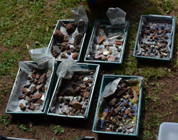 Trays of archaeological finds drying outside
